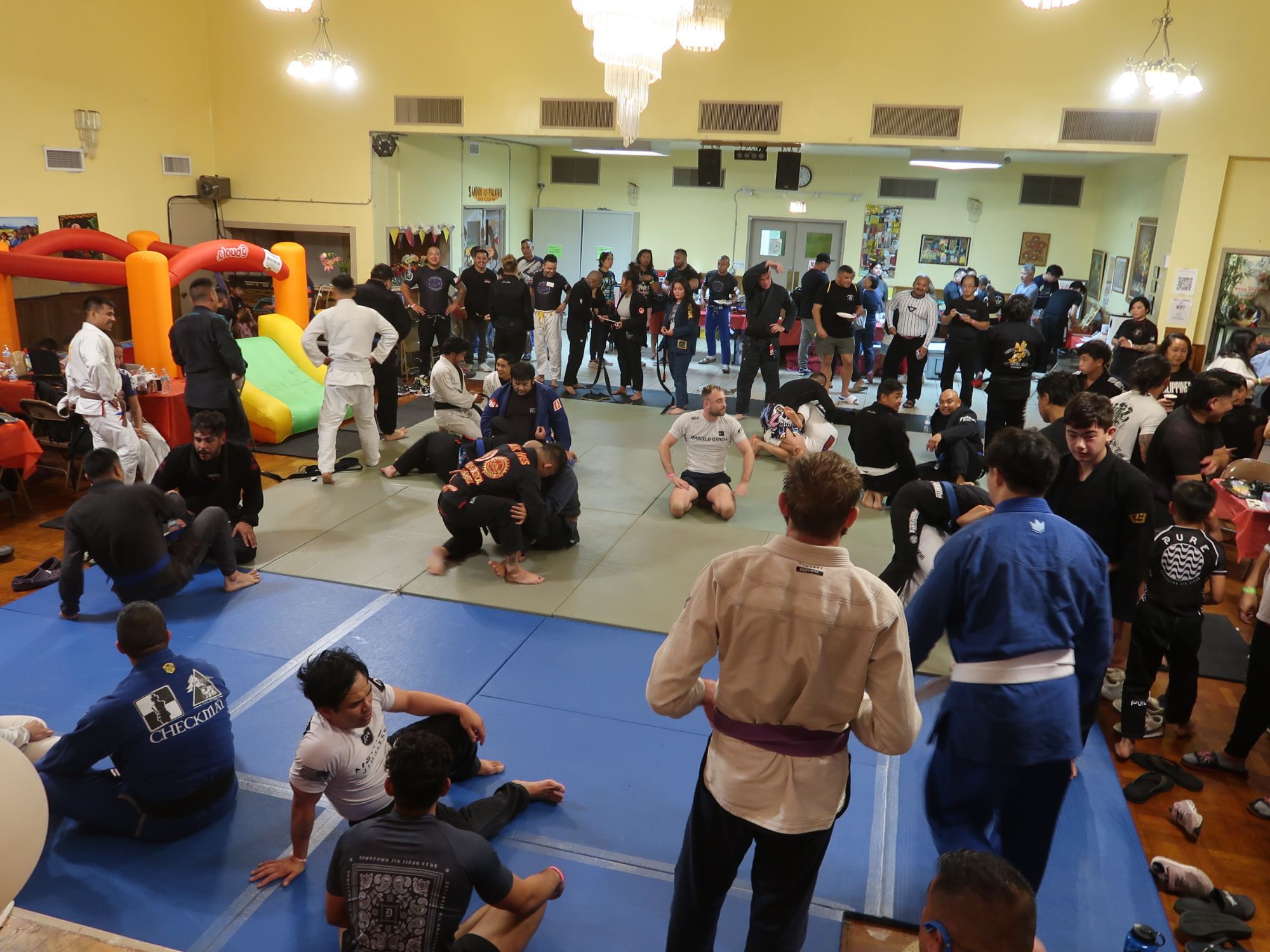 A packed room of students and supporters training and gathered together at a Project Clarito community fundraiser.